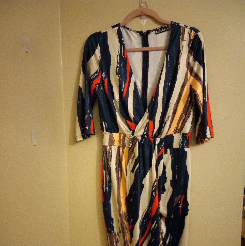 Women's fitted multi color dress. Slit in the middle. Size L never worn
